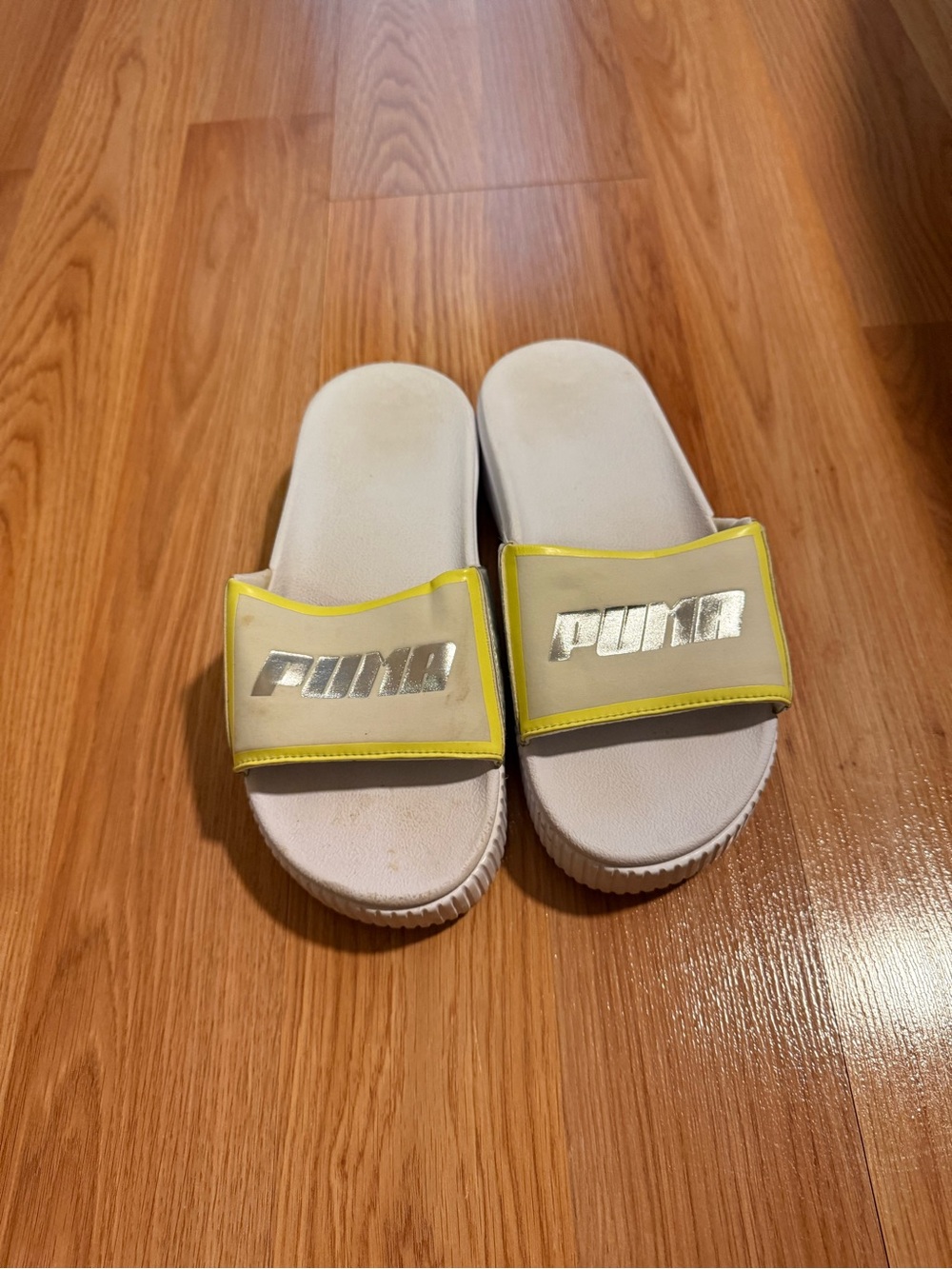 Puma Kids White Slide Sandals with Yellow Trim and Silver Logo